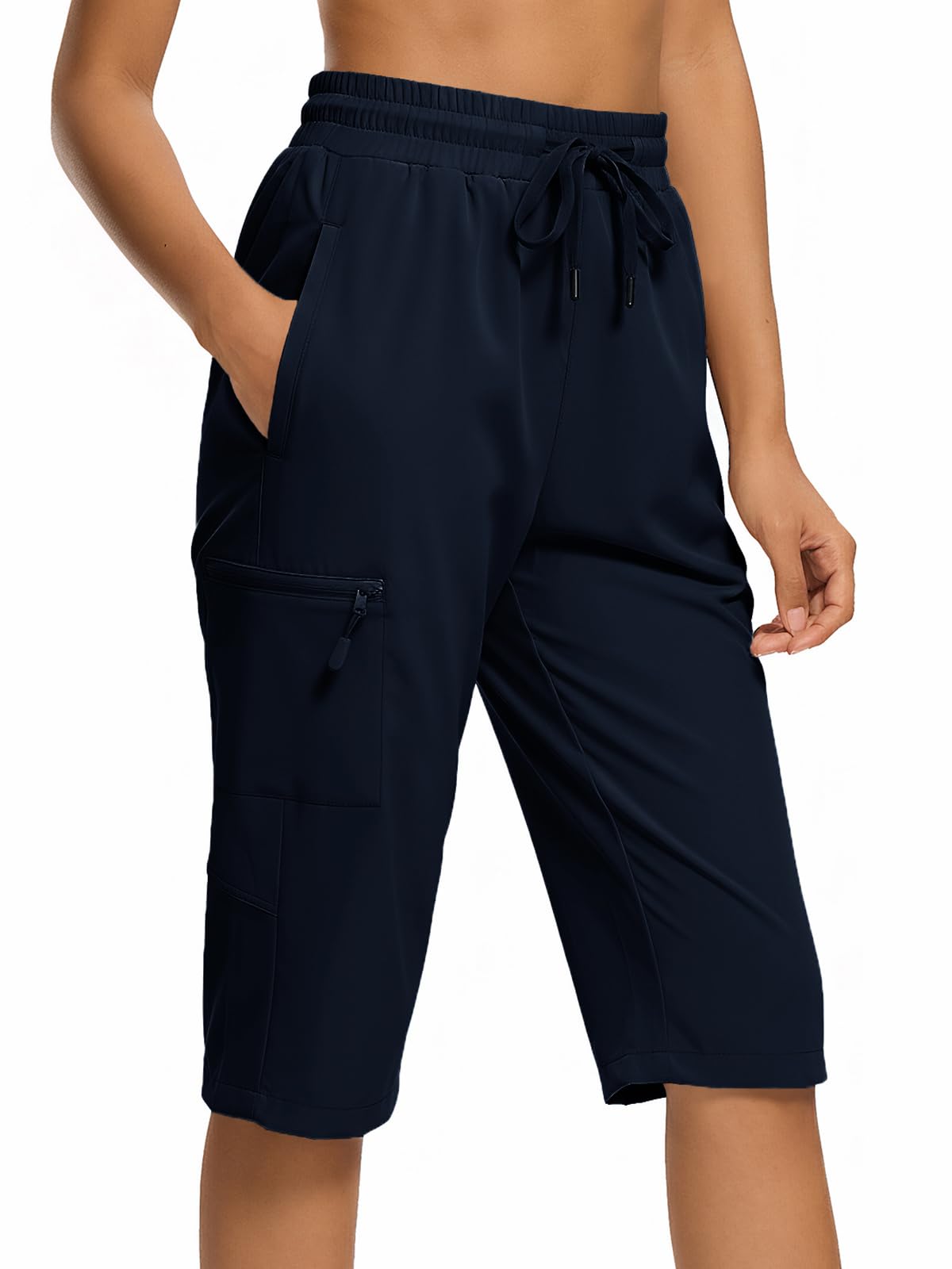 DEVOROPA hiking shorts front view with navy fabric and zip pockets for secure storage