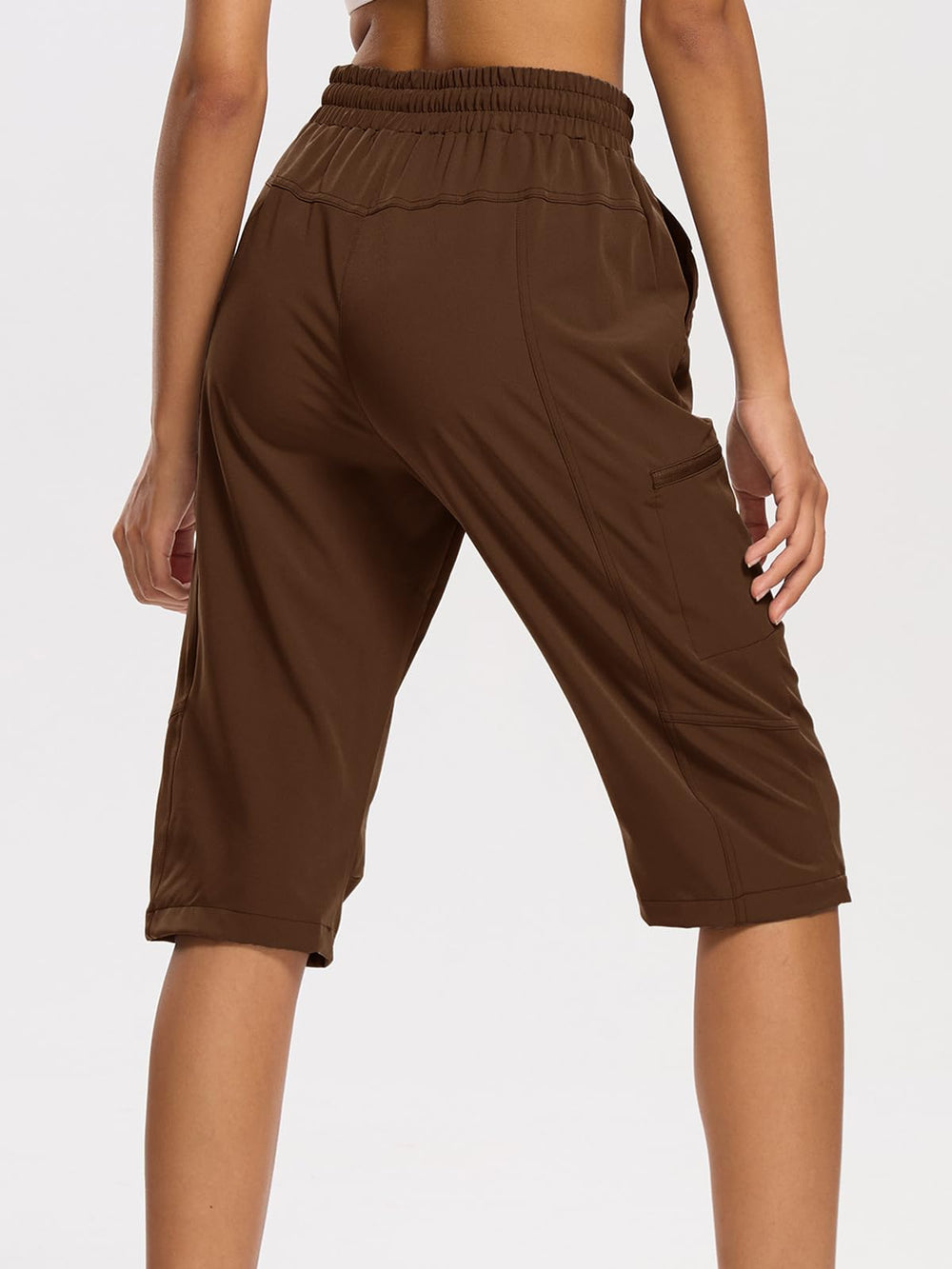 DEVOROPA women's hiking long shorts side view pocket highlights secure zipper pockets for valuables.