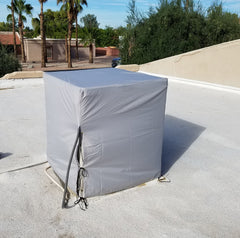 Dial down-draft WeatherGuard cover installed on evaporative cooler showing secure fit.