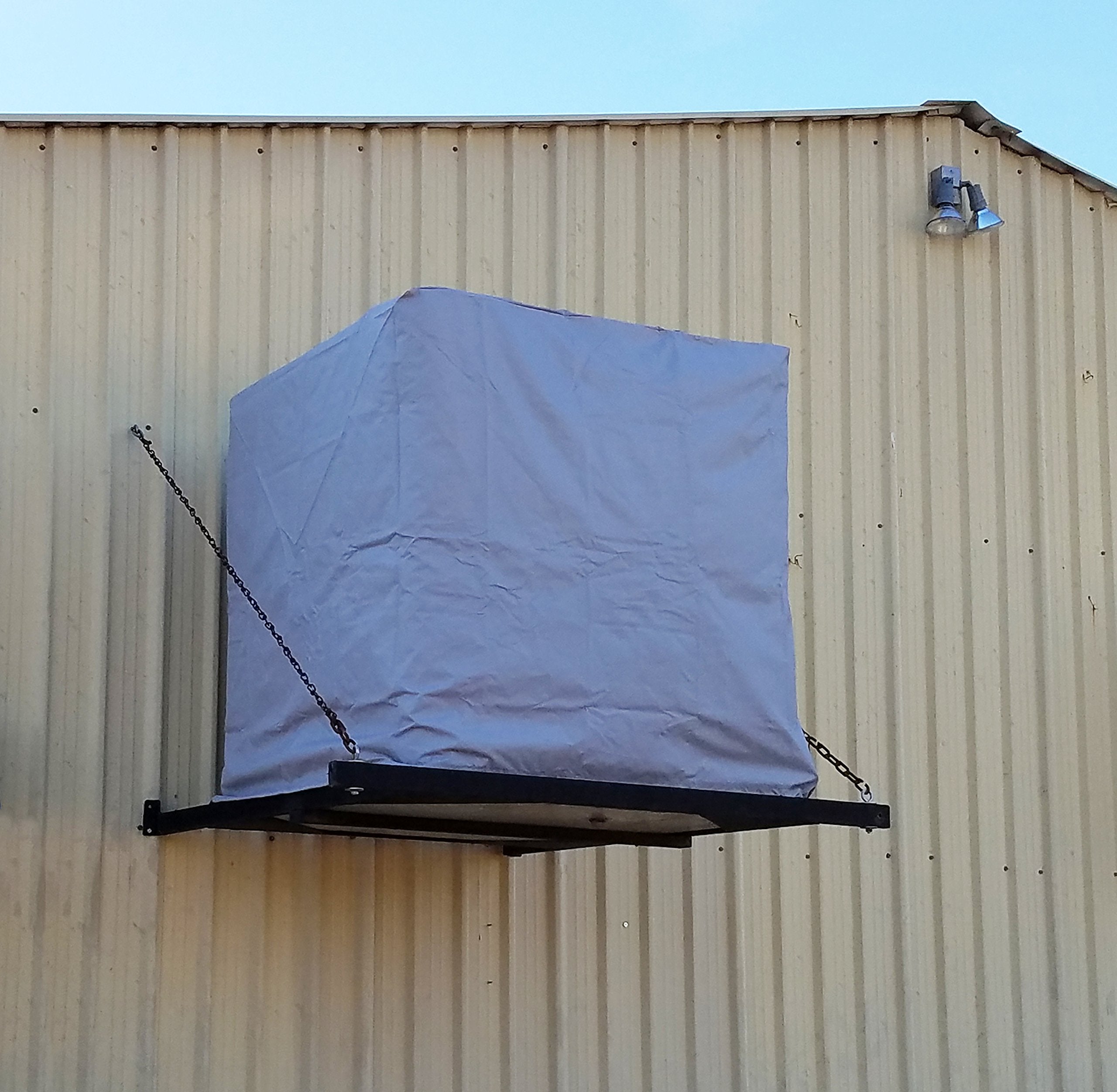 Dial evaporative cooler cover shields from weather, helping keep the unit ready.