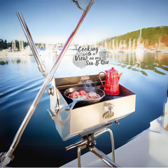 Dickinson Sea-B-Que Large side view on deck, durable marine-grade stainless.