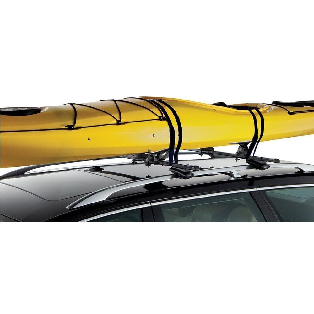 DORSAL strap securing a paddleboard on a roof rack for travel