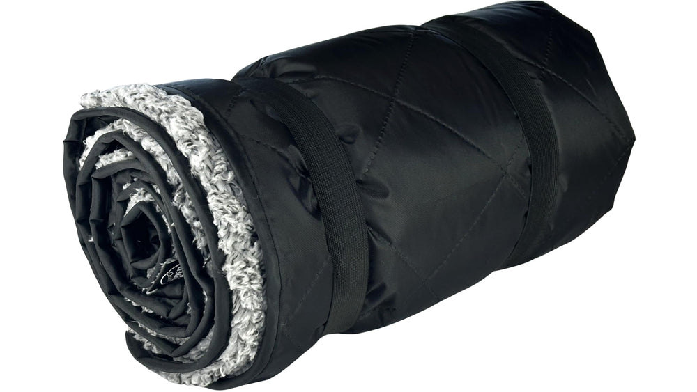 Down Under Outdoors 82x55 blanket shown with a stuff sack for travel storage.