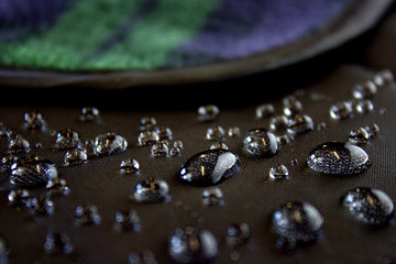 DOWN UNDER OUTDOORS waterproof-windproof-back keeps you dry on damp bleachers