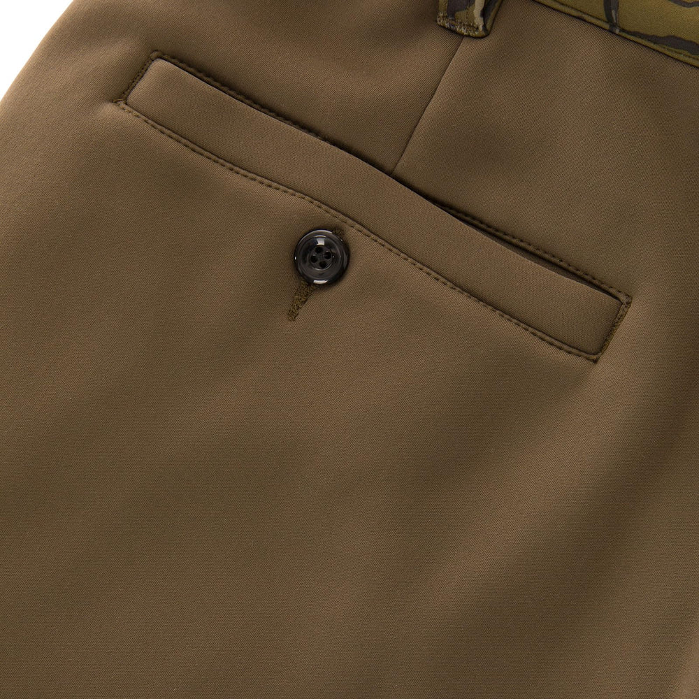 Drake Waterfowl Youth Endurance Pants ankle cuffs demonstrated for secure layering.