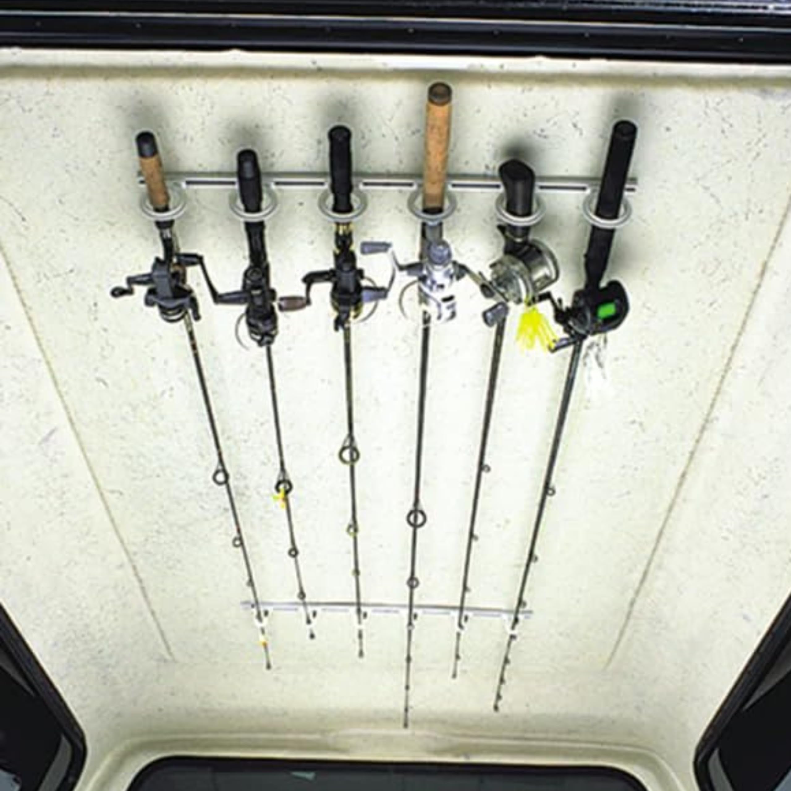 System holding up to six fishing rods securely in place