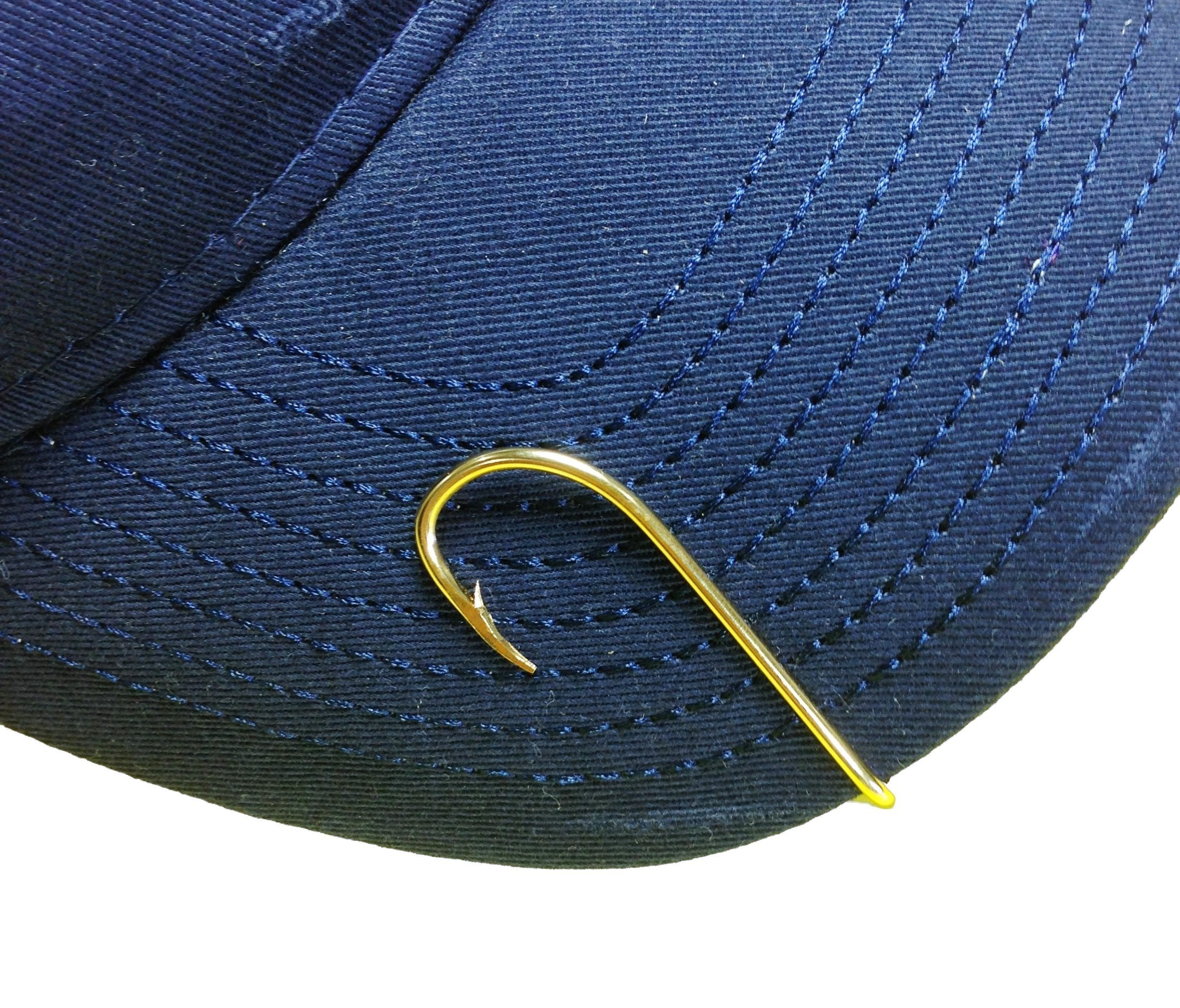 Hat brim with Eagle Claw gold hat hook securely attached during wear.