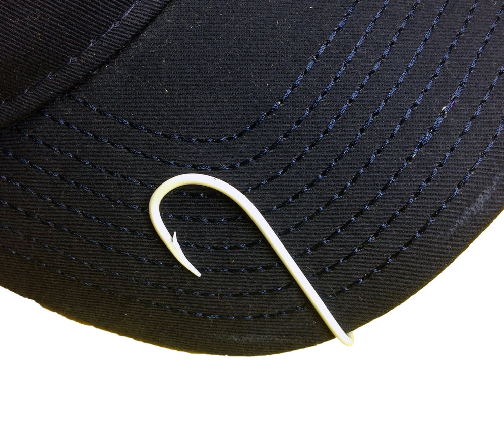 Eagle Claw white hat hook pins on cap bill for quick style upgrade.
