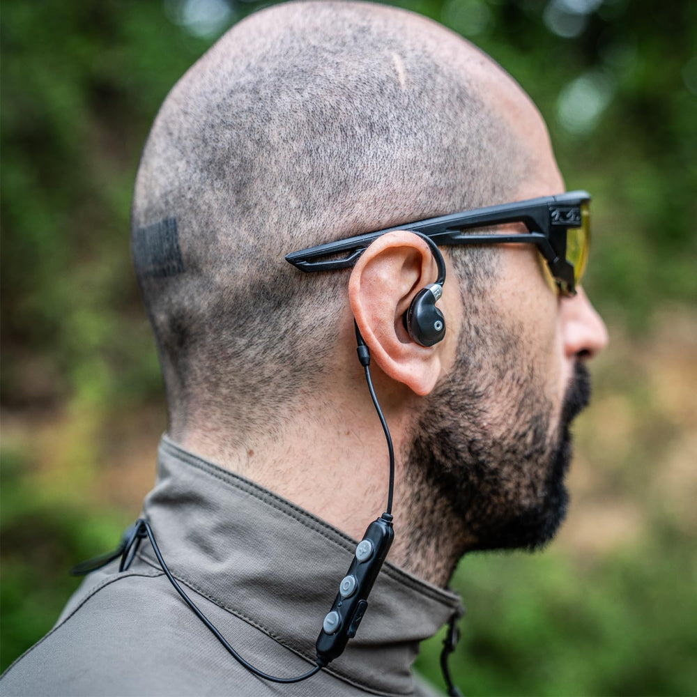 EARMOR M200T noise-cancelling earbuds shielding hearing while preserving situational awareness.