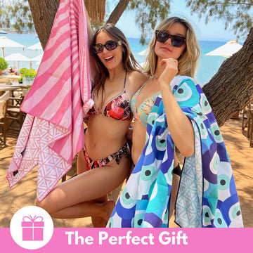 ECCOSOPHY microfiber beach towel oversized for adults on the sand, lounging comfortably.
