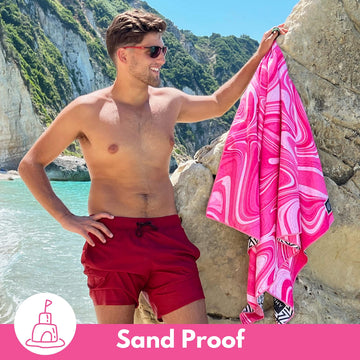 ECCOSOPHY two-sided Bahamas print towel for versatile beach styling.