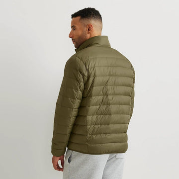 Eddie Bauer CirrusLite packable in its pouch showcases travel-ready versatility and lightweight layering.