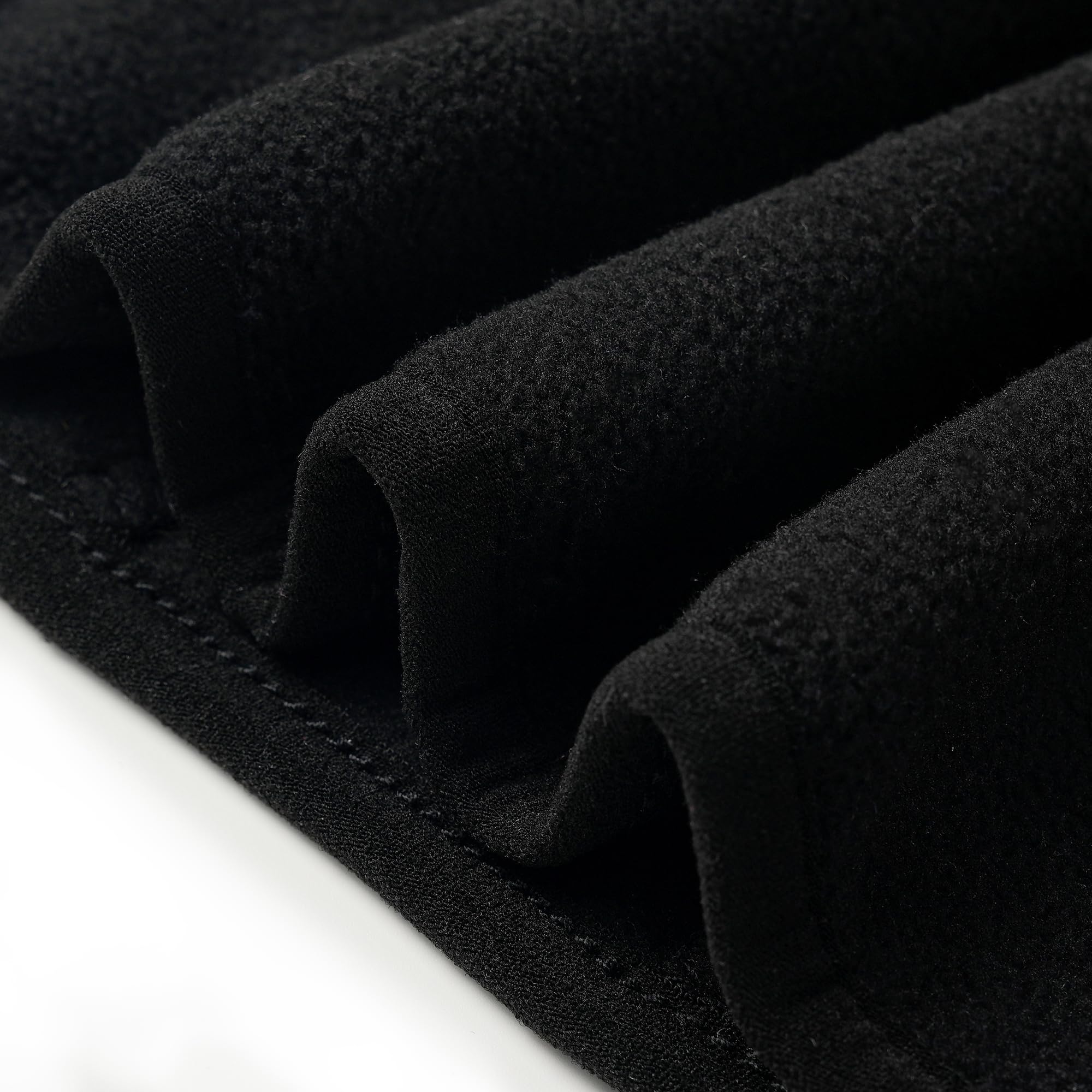 Fabric close-up reveals brushed finish and gentle texture.