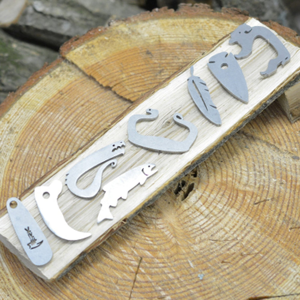 EmberLit pendant-ready arrow head steel design for wear and quick access.