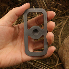 Emergency fire starter in hand demonstrates compact, portable design.