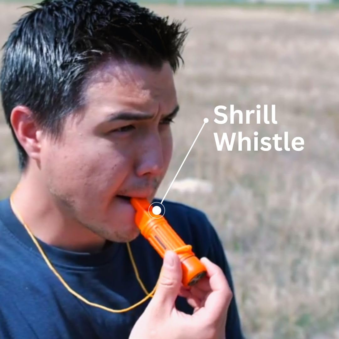 Emergency Zone whistle with signal mirror for daylight signaling in open terrain.