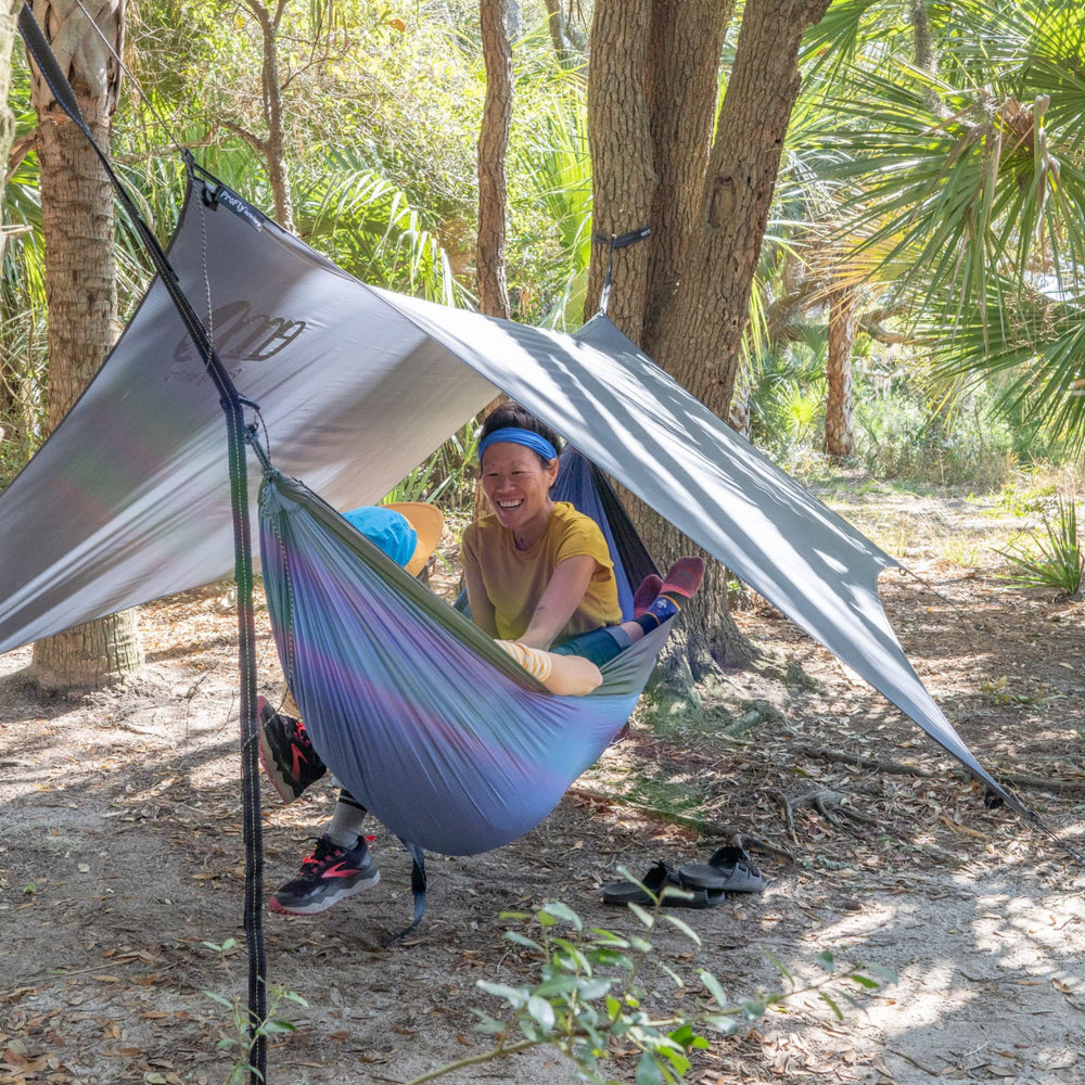 ENO ProFly waterfront basecamp scene highlights all-weather shelter.