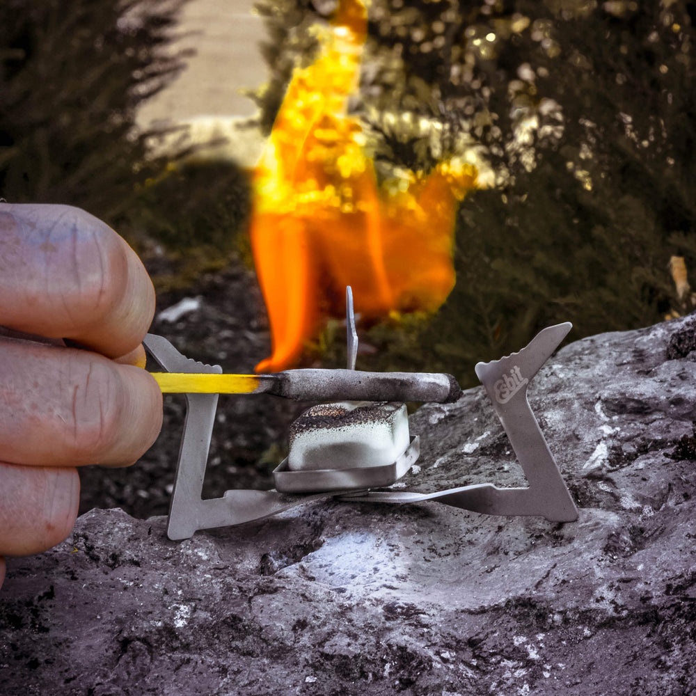 Esbit camping stove setup with 4g fuel tablets for quick heat.