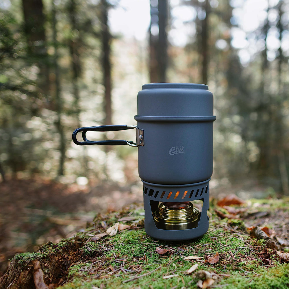Esbit solid fuel base and included stove accessories.