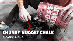 Escape Climbing Sick Dyno climber applying chalk to fingers for grip.
