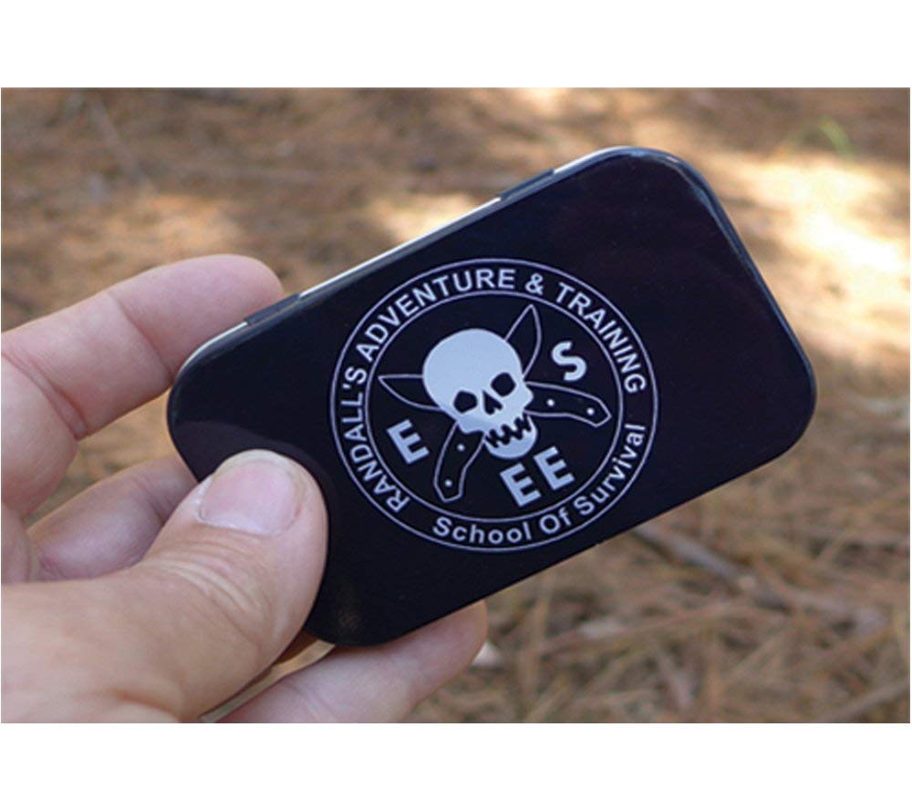 Cordage and compass tucked inside the tin for improvised fixes
