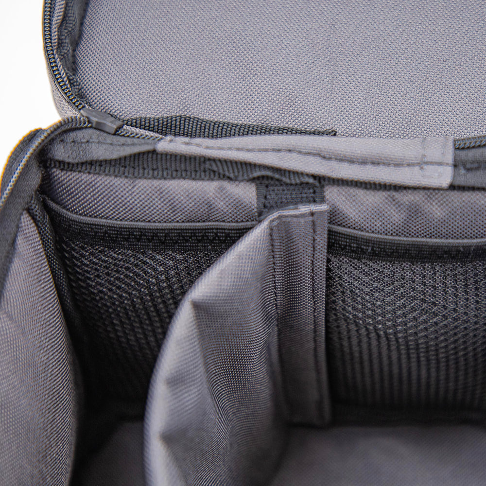 Handles and interior pockets keep hand warmers and small items ready for quick access.