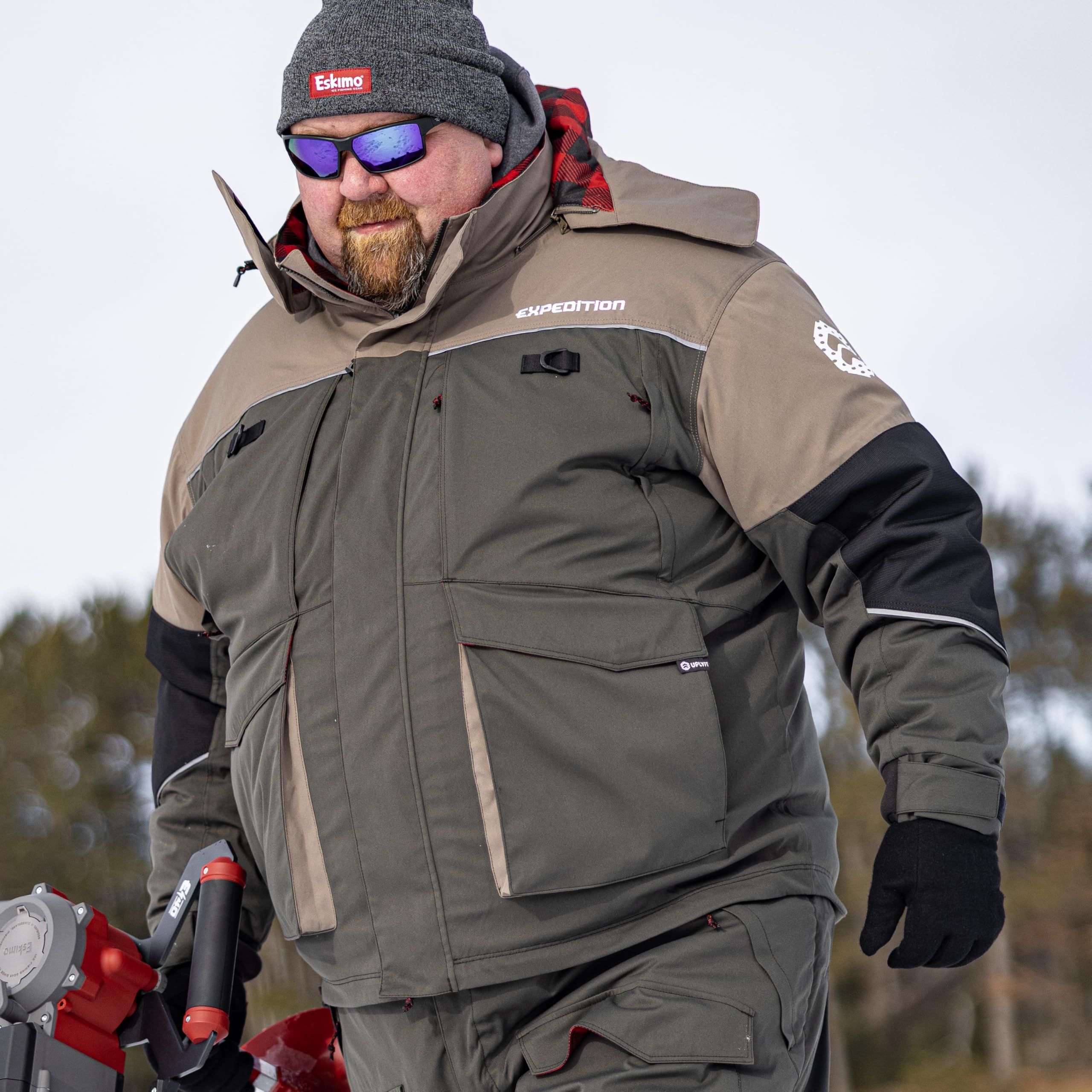 Eskimo Expedition Jacket side view in action, flexible DuraDry stretch for unrestricted movement.