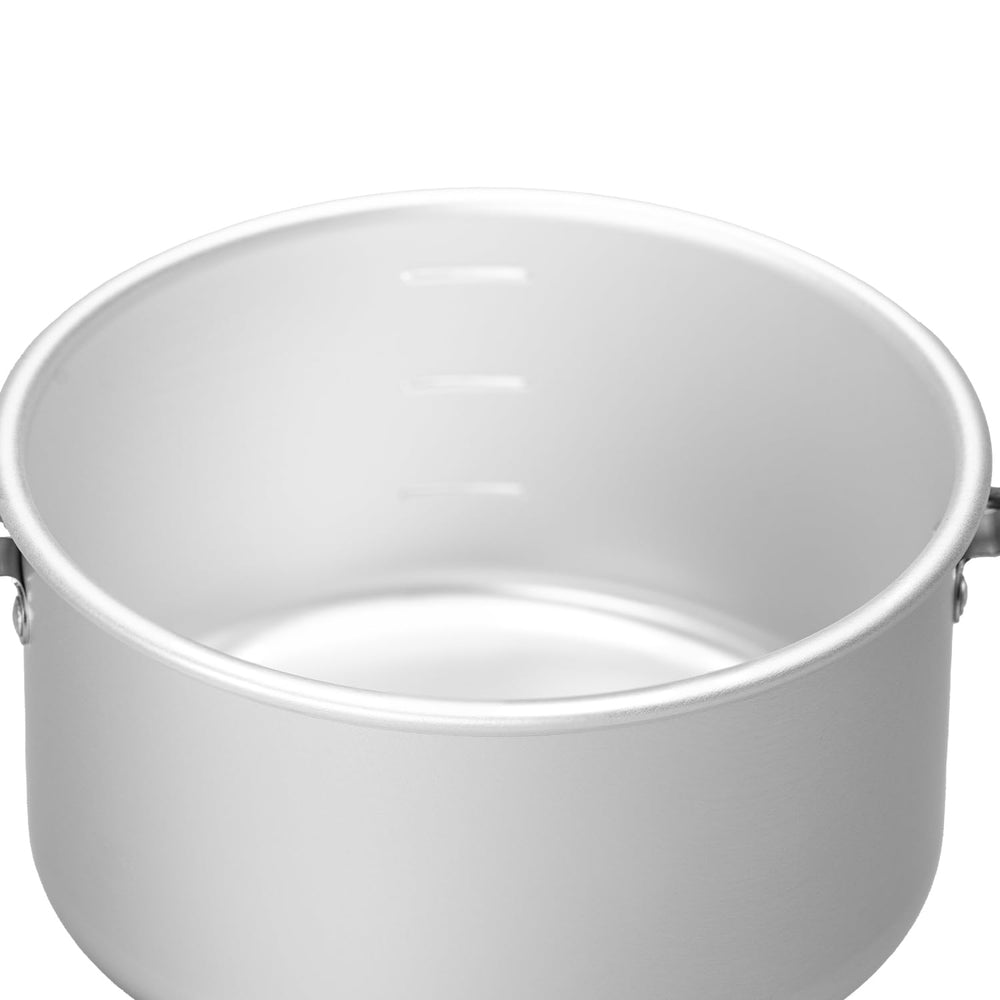 Evernew Backcountry Almi Pot lid demonstrates oven-style cooking with charcoal heat.