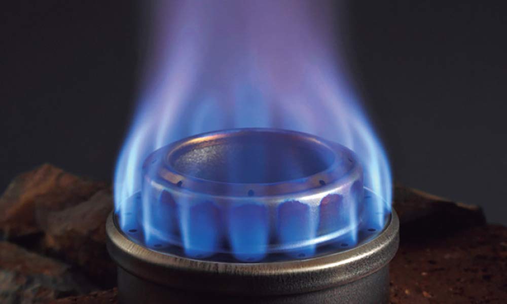 Evernew stove with wind protection from the DX stand for steady flame outdoors.