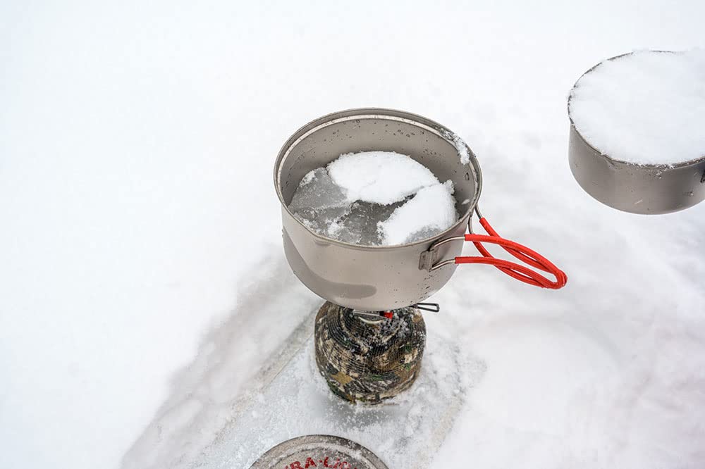 Evernew ultralight hiking setup featuring titanium pot on the trail