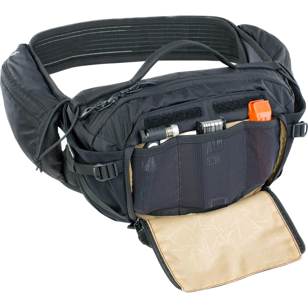 EVOC AIRO FLEX waist belt close-up emphasizes secure grip and ventilation