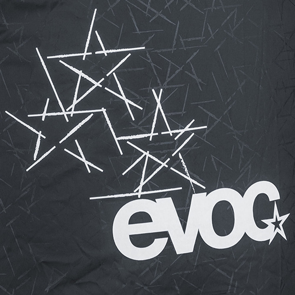 EVOC Raincover reflective print boosts visibility for safe night riding.
