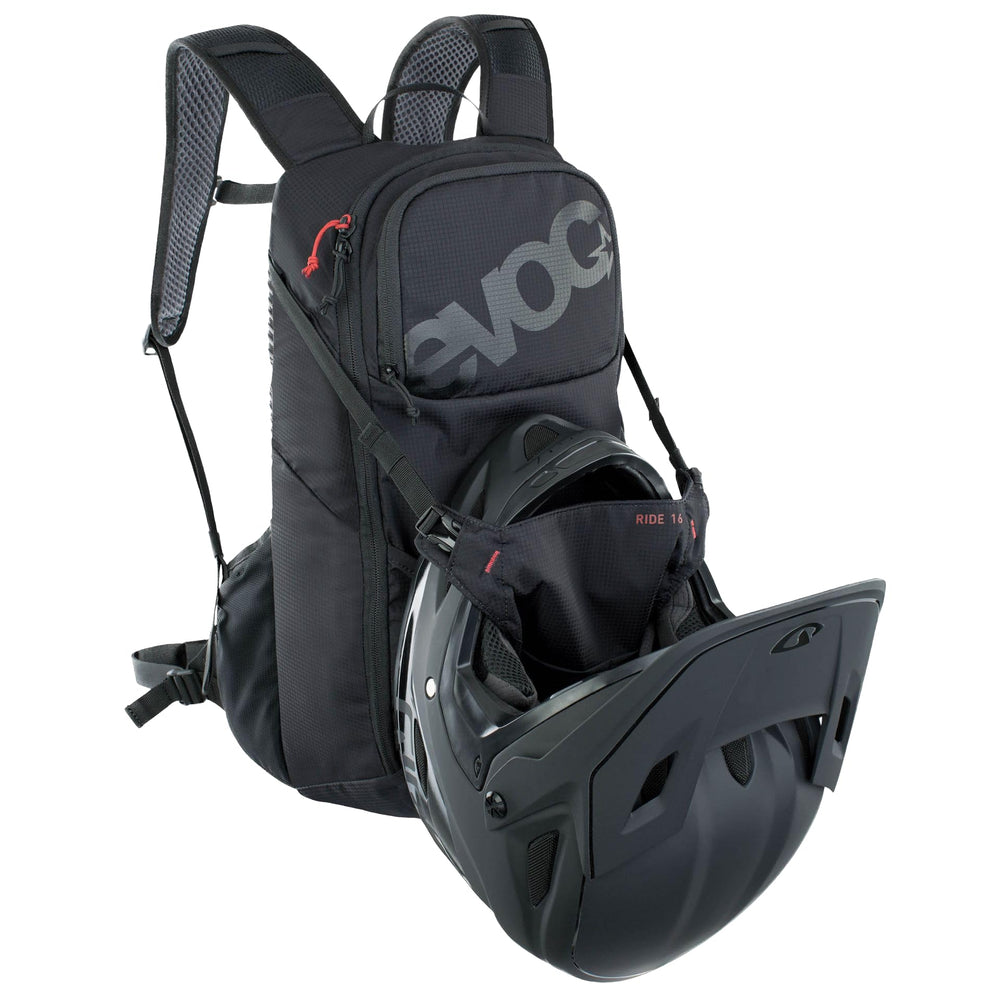 EVOC Ride 16 helmet holder supports safe, quick helmet access