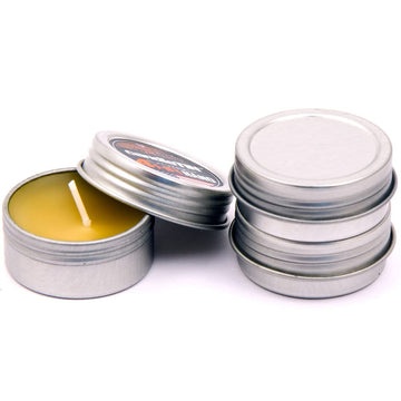 Exotac candleTIN Nano emergency beeswax tealight 3-pack closeup showing a steady warm glow.