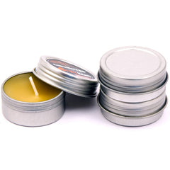 Exotac candleTIN Nano emergency beeswax tealight 3-pack closeup showing a steady warm glow.