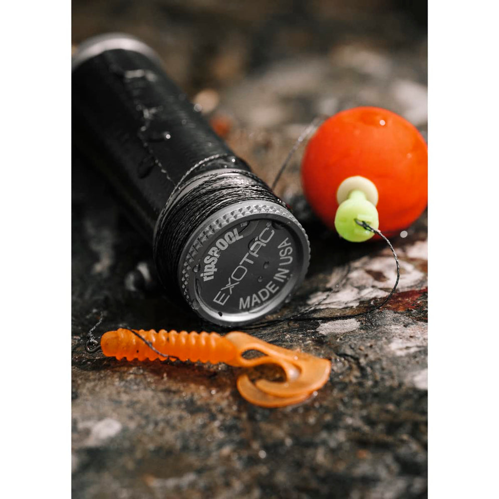 Exotac ripSPOOL field-repair in use on compact survival gear