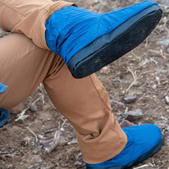 Exped Camp Booty fast-drying material image underlines quick-dry ability lakeside or on snow.