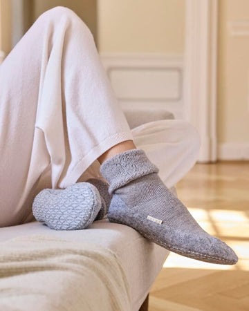 FALKE Cosyshoe silicone grip soles reduce slipping on smooth floors.
