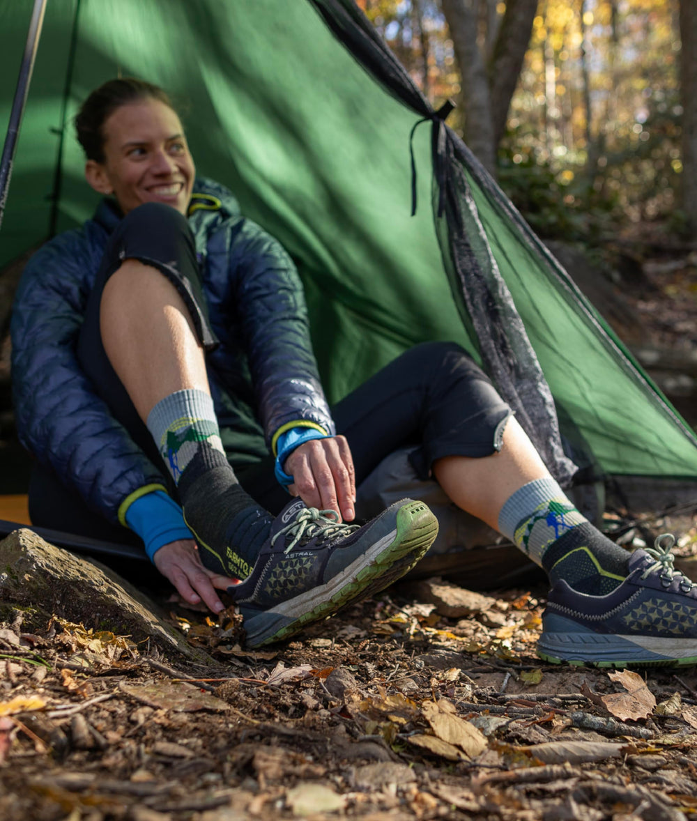 Reinforced seams on Farm To Feet socks reduce wear and blister friction during hiking.