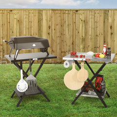 Feasto folding grill table bottom shelf stores condiments and bottles.