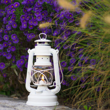 Feuerhand lantern in a camping scene providing warm non-electric illumination.