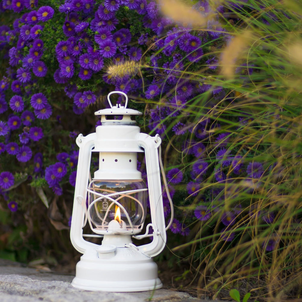 Feuerhand lantern in a camping scene providing warm non-electric illumination.