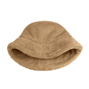 Lifestyle shot of a model wearing Clakllie Khaki faux fur bucket hat outdoors