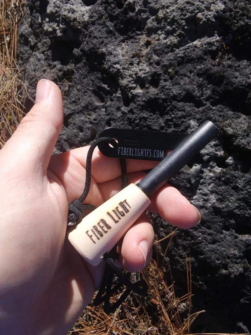 Fiber Light portable fire starter tucked in a pocket for hikers