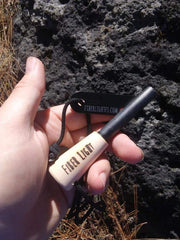 Fiber Light portable fire starter tucked in a pocket for hikers