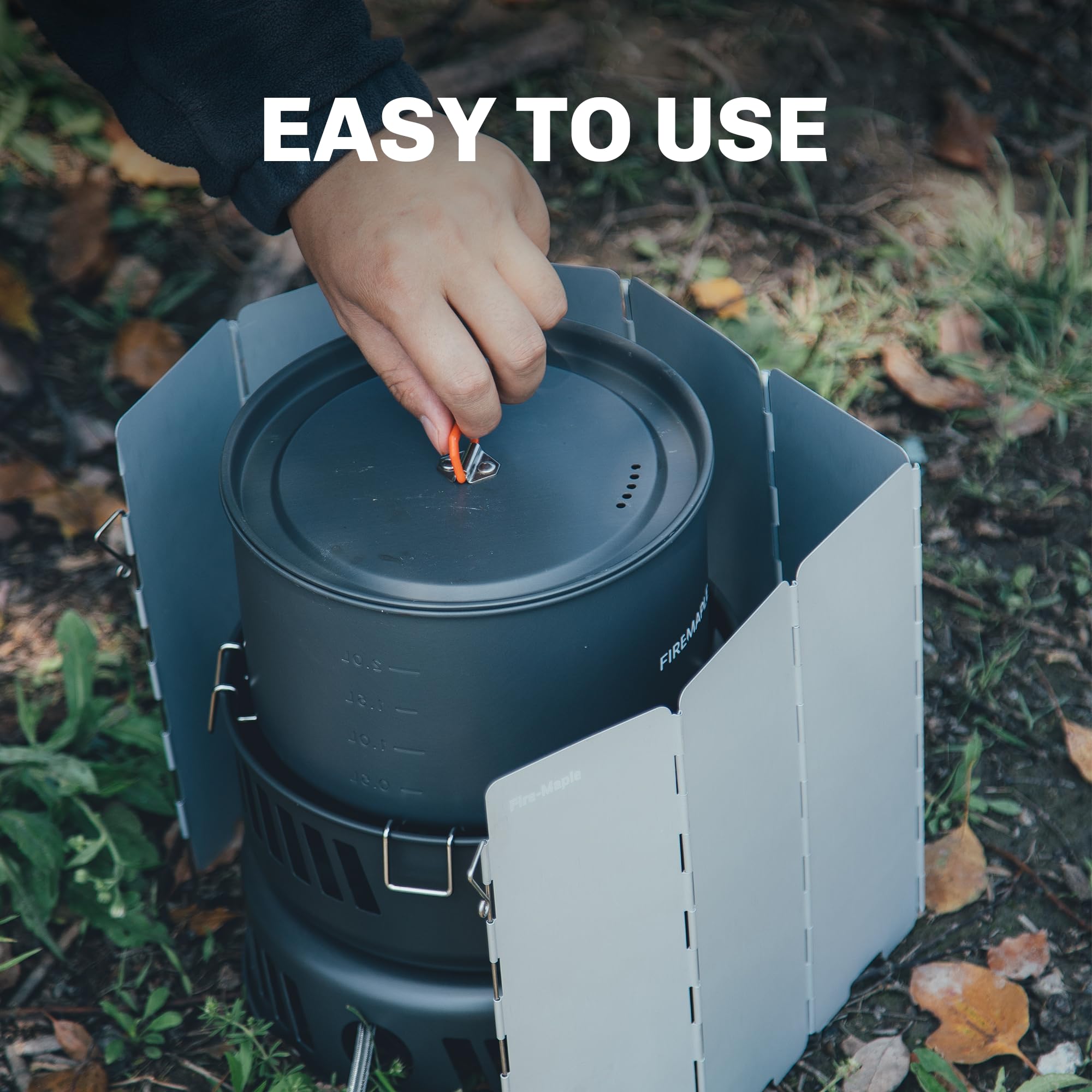 Fire-Maple camping stove in use during a rugged outdoor meal.