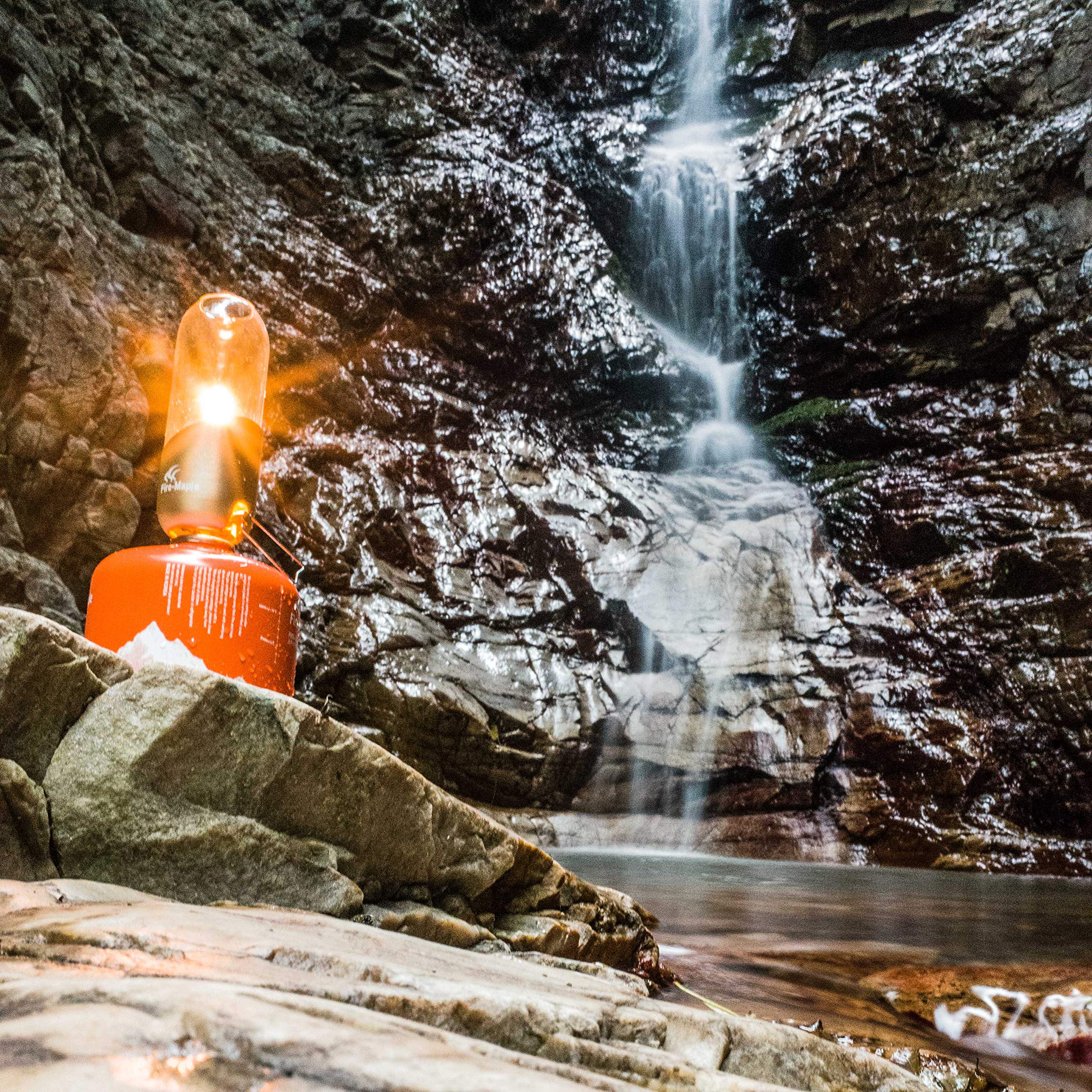Fire-Maple orange camping lantern adapter compatibility for larger propane uses.