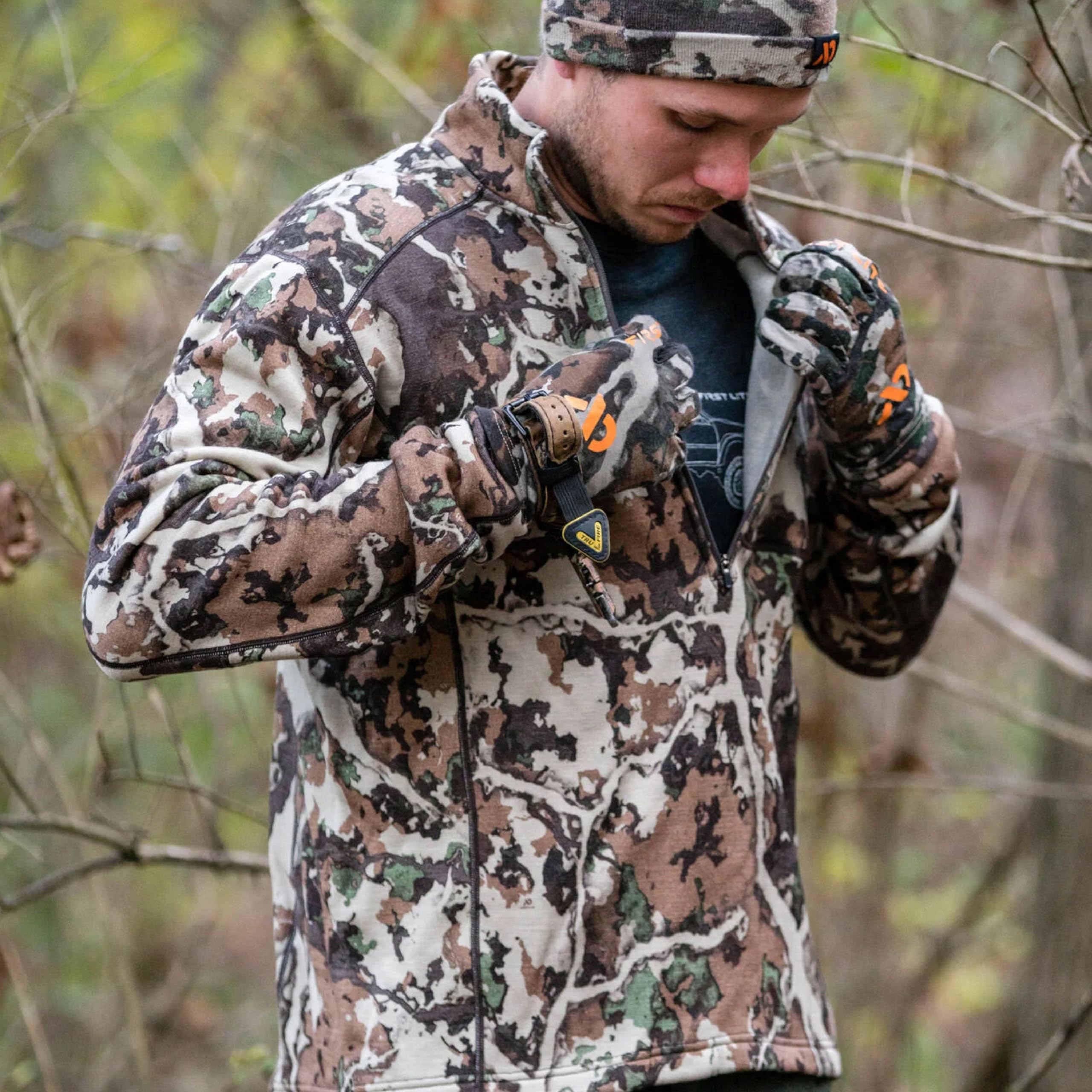 First Lite Merino-X EXP fabric texture detail highlighting breathable warmth.
