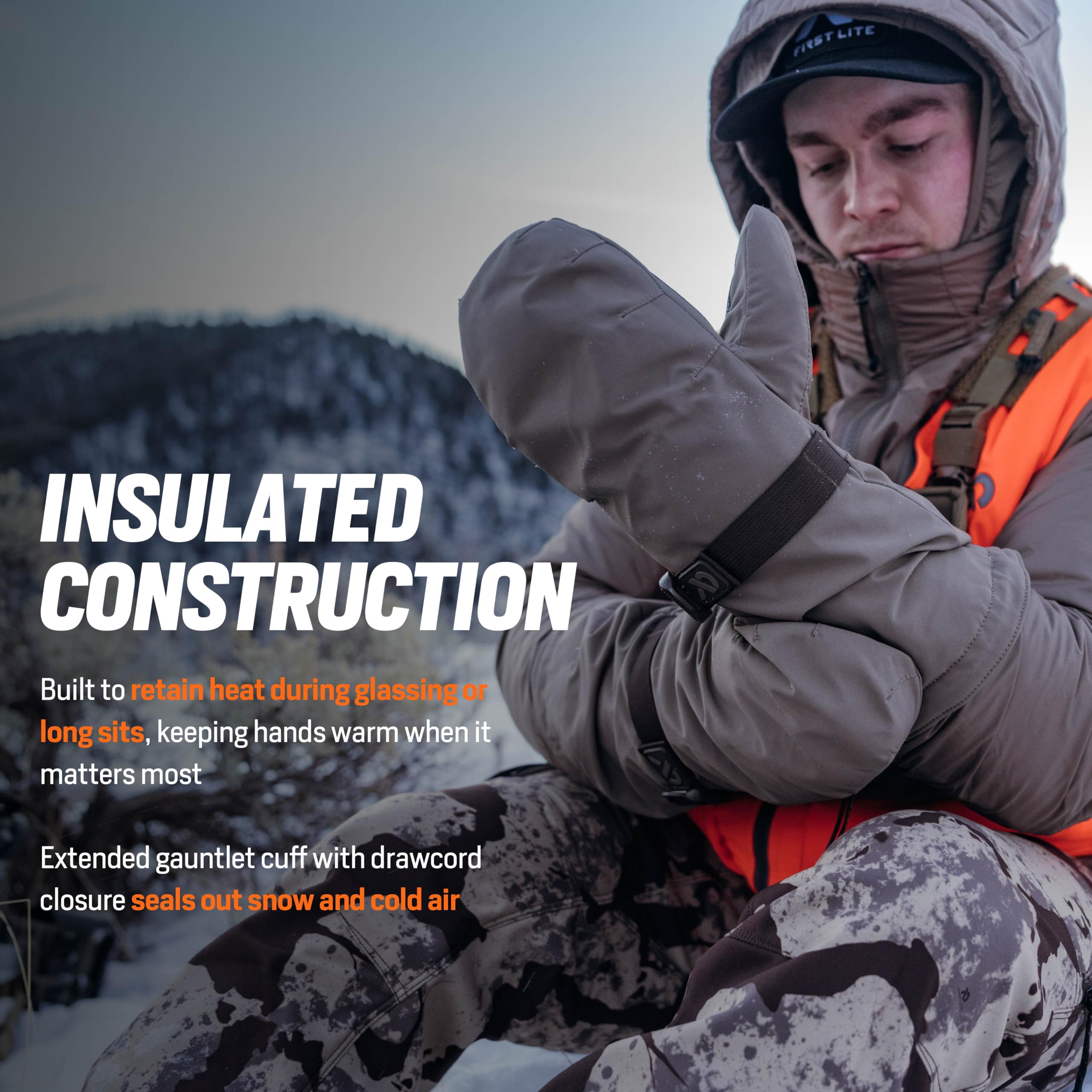 First Lite Omen Over Mitt extended gauntlet cuff sealing out snow for protection.