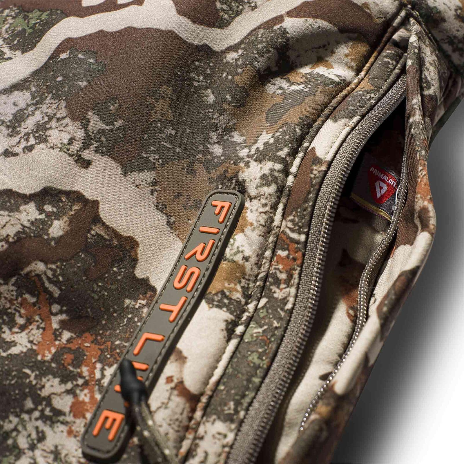 First Lite Thermic Muff interior sherpa lining, soft warmth for long hunts.